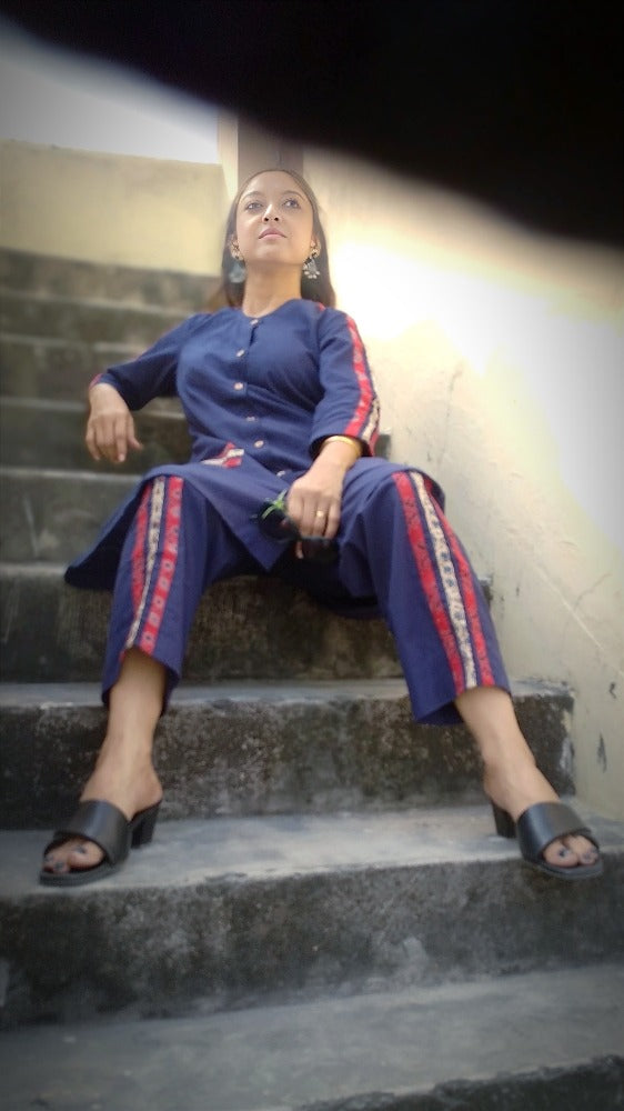 
                  
                    TSAVO - Smart fit, Ajrakh Hand block print highlighted Slim Fit Navy Blue Cotton round neck Kurta Set with palazzo.
                  
                
