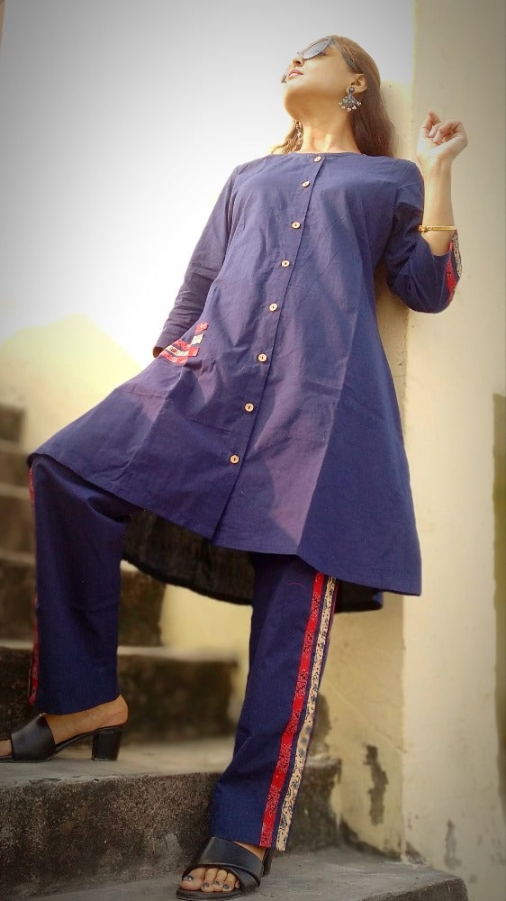 
                  
                    TSAVO - Smart fit, Ajrakh Hand block print highlighted Slim Fit Navy Blue Cotton round neck Kurta Set with palazzo.
                  
                
