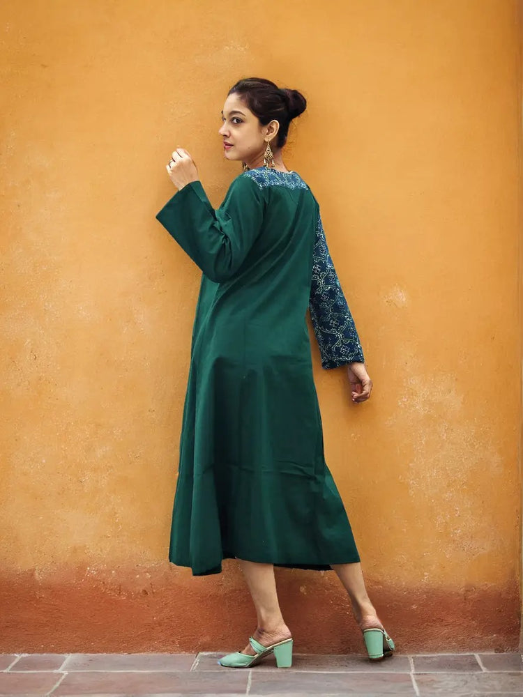 
                  
                    ABASHA - Free Flow Kimono themed Front Up Back Down Flow Dress Ajrakh block Print highlights on right Sleeve and Neck Line .
                  
                
