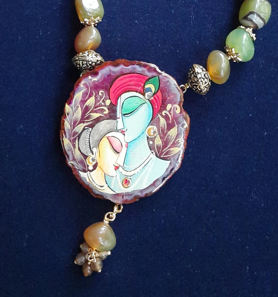 
                  
                    Enchanting mixed light green and brown agate nugget beads necklace with matching Radhakrishna pendant
                  
                