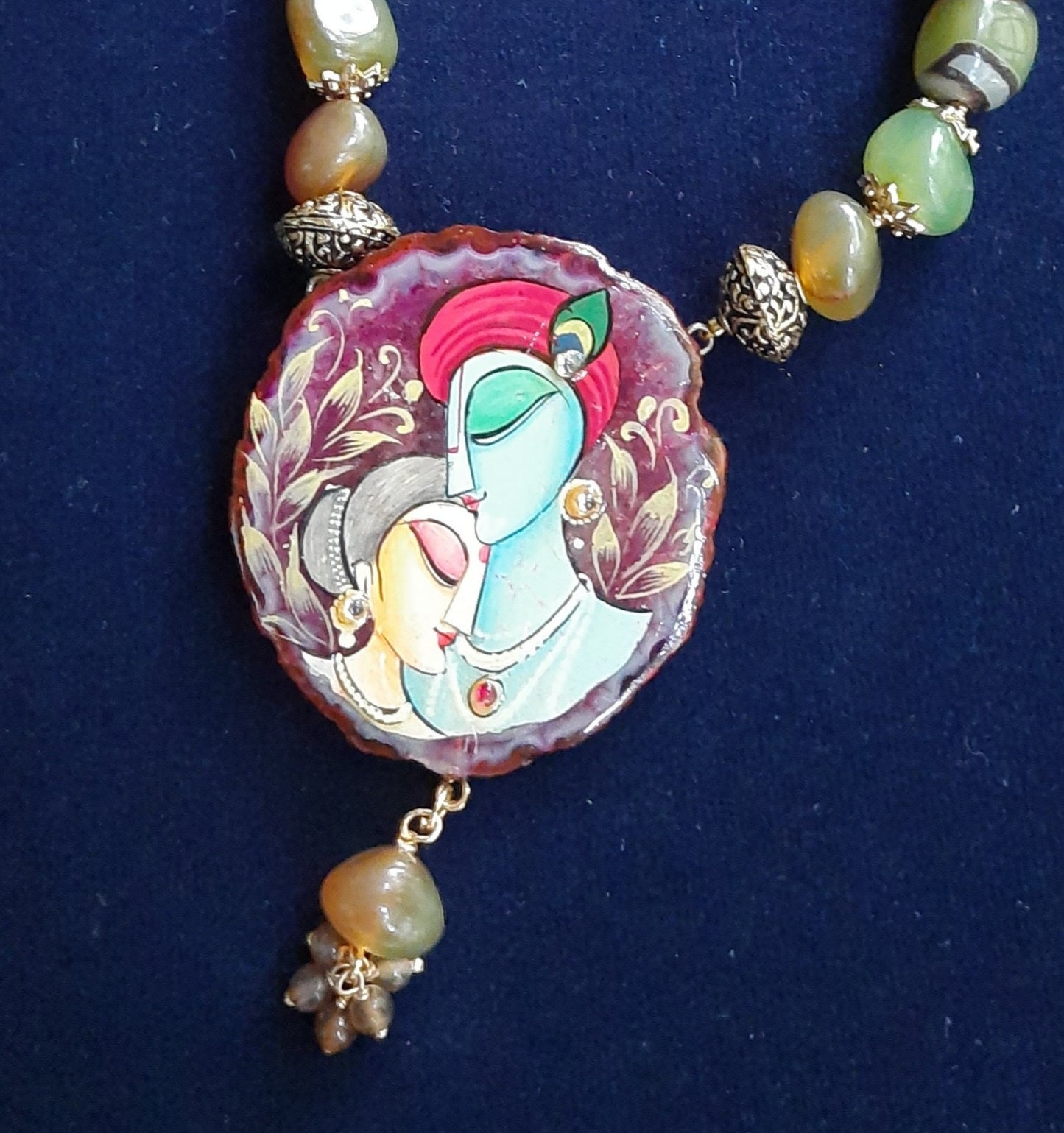 
                  
                    Enchanting mixed light green and brown agate nugget beads necklace with matching Radhakrishna pendant
                  
                