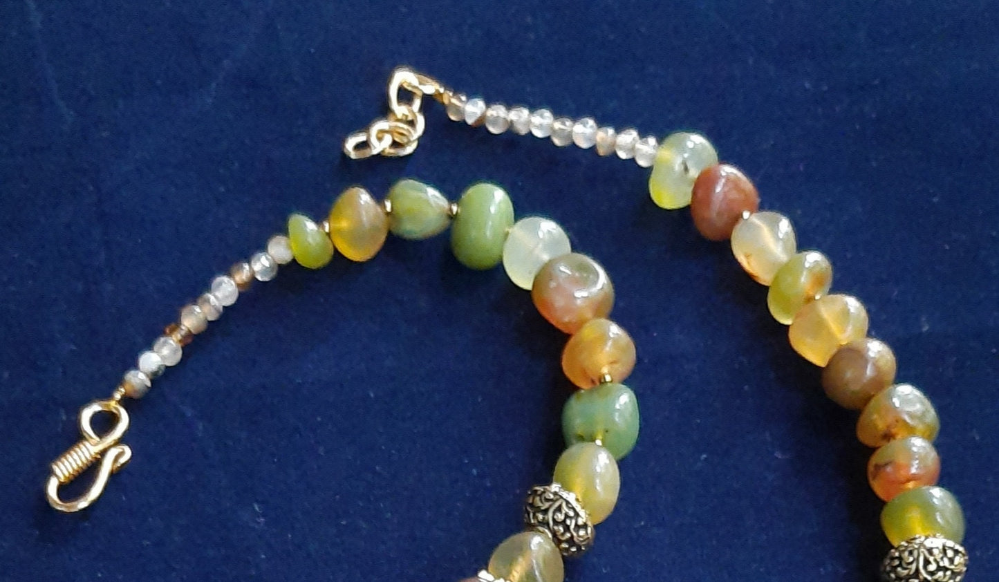 
                  
                    Enchanting mixed light green and brown agate nugget beads necklace with matching Radhakrishna pendant
                  
                