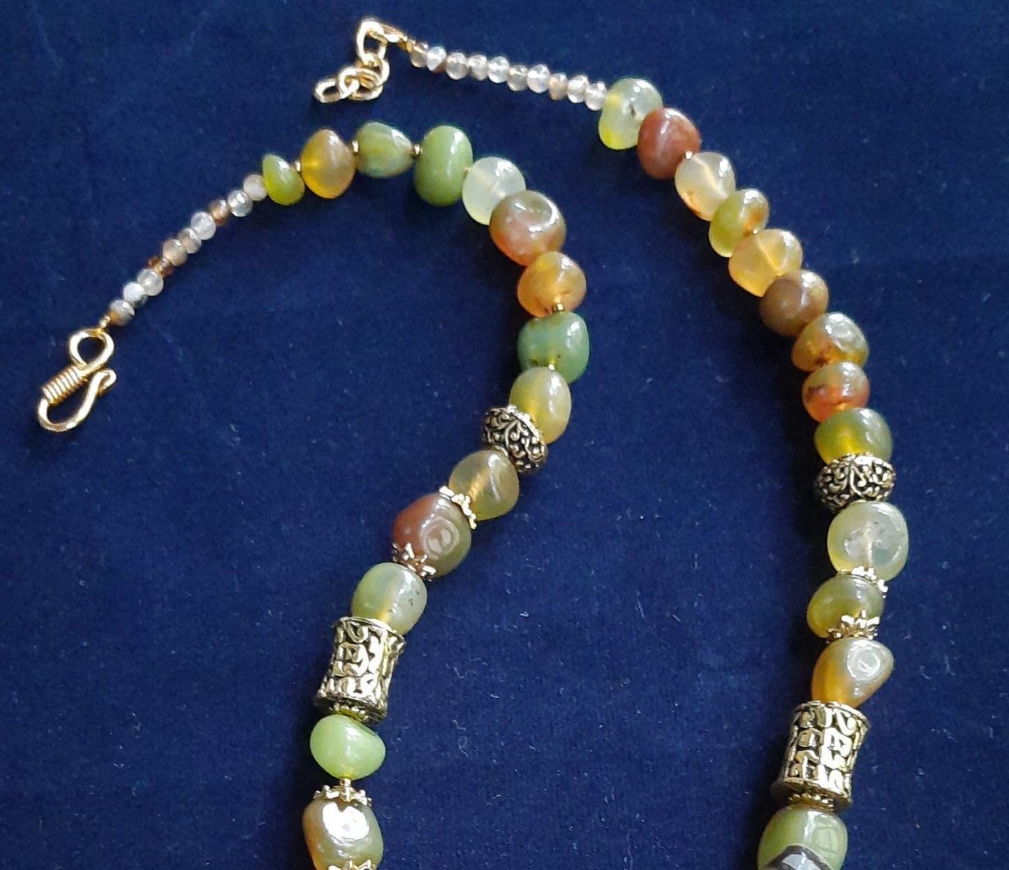 
                  
                    Enchanting mixed light green and brown agate nugget beads necklace with matching Radhakrishna pendant
                  
                