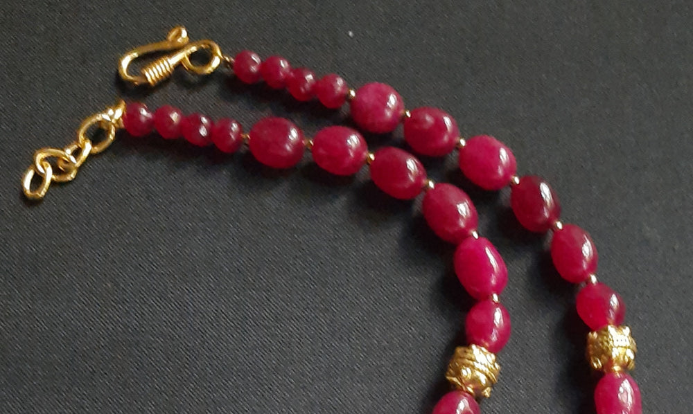 
                  
                    Gorgeous ruby red Dul Dul agate beads necklace with peacock pendant and matching peacock earrings.
                  
                