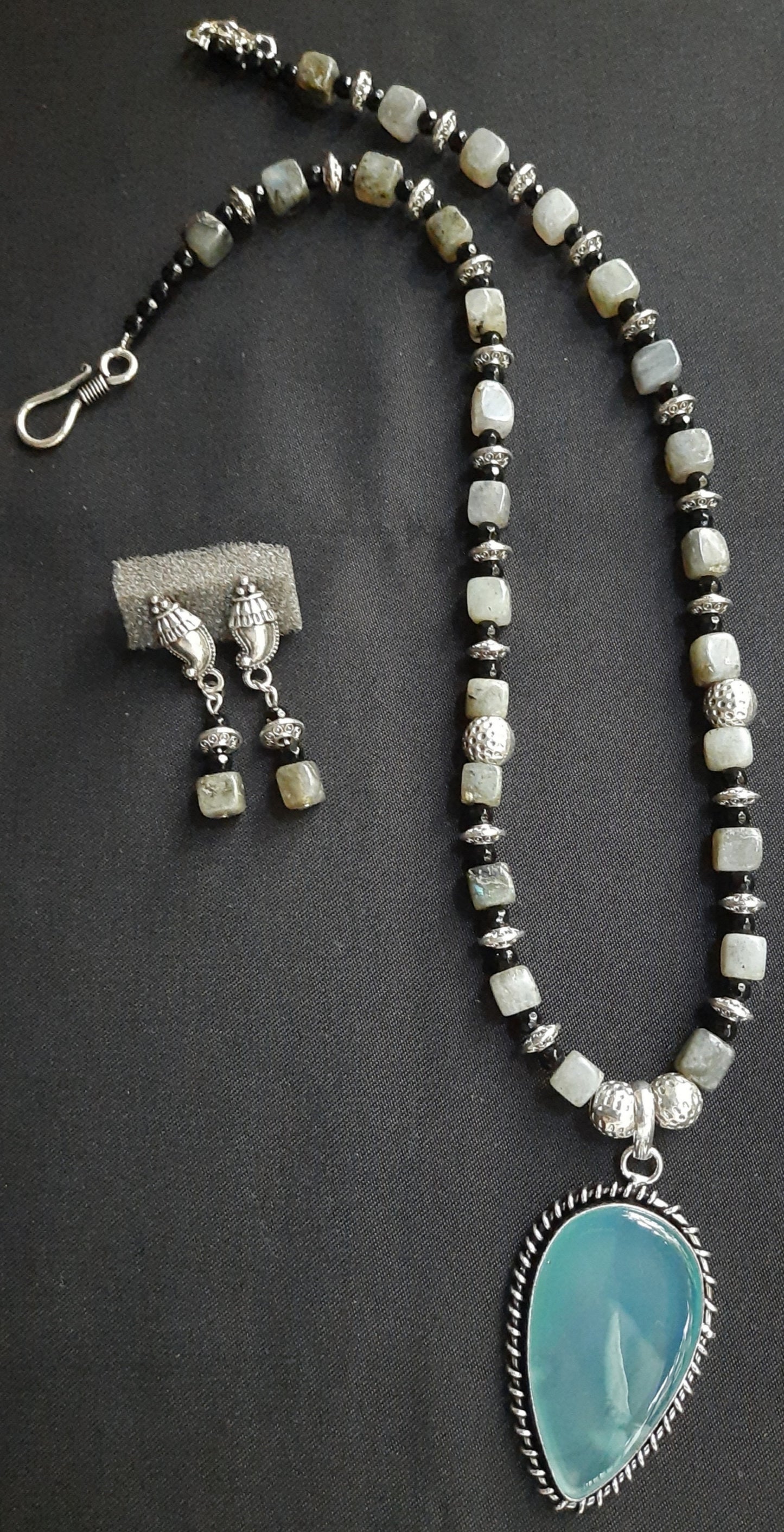 
                  
                    Stylish Grey Colour Square Agate Beads Necklace With matching pendant and earrings.
                  
                