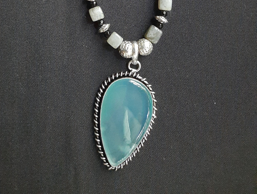
                  
                    Stylish Grey Colour Square Agate Beads Necklace With matching pendant and earrings.
                  
                