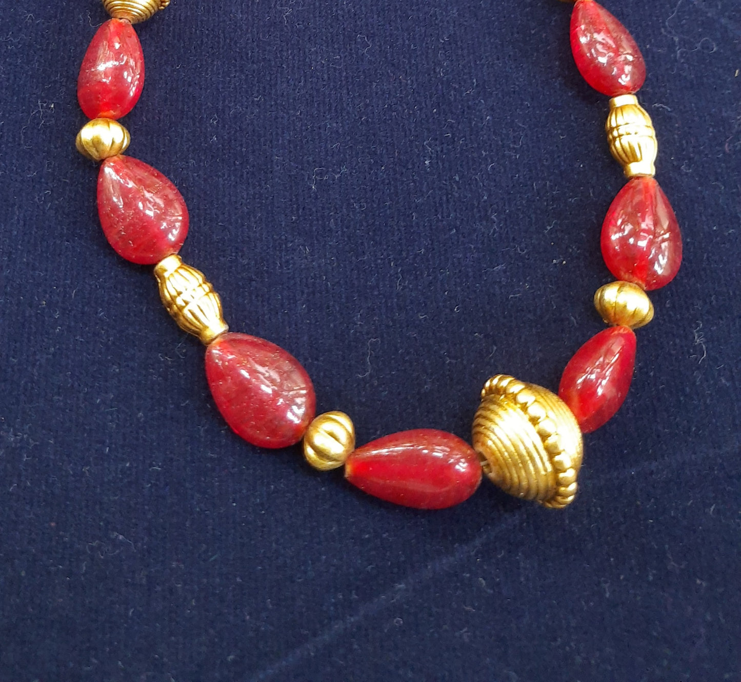 
                  
                    Ethinic red glass beads neckpiece with matching earrings.
                  
                