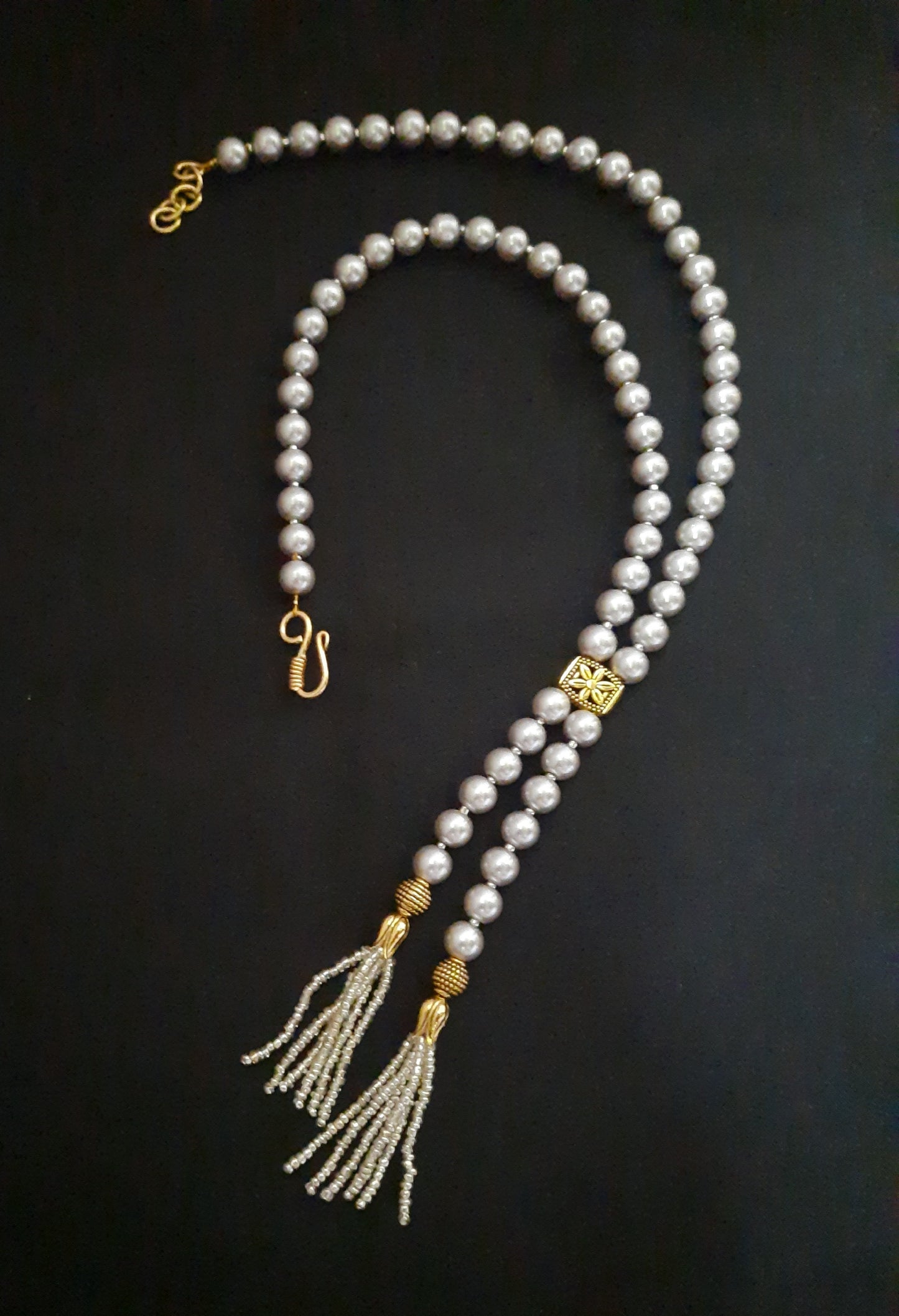 
                  
                    Classic grey shaded shell pearl mala
                  
                