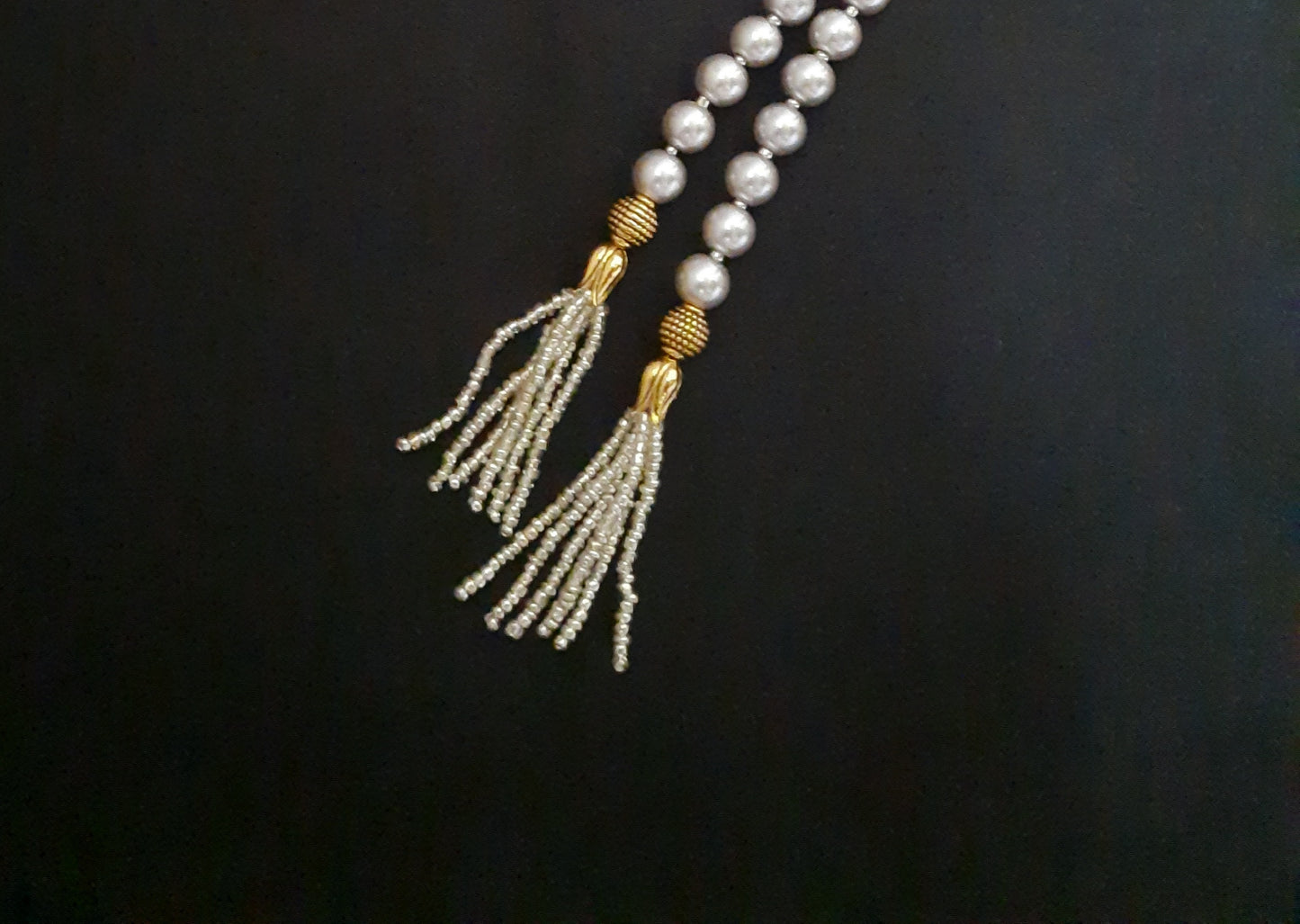 
                  
                    Classic grey shaded shell pearl mala
                  
                