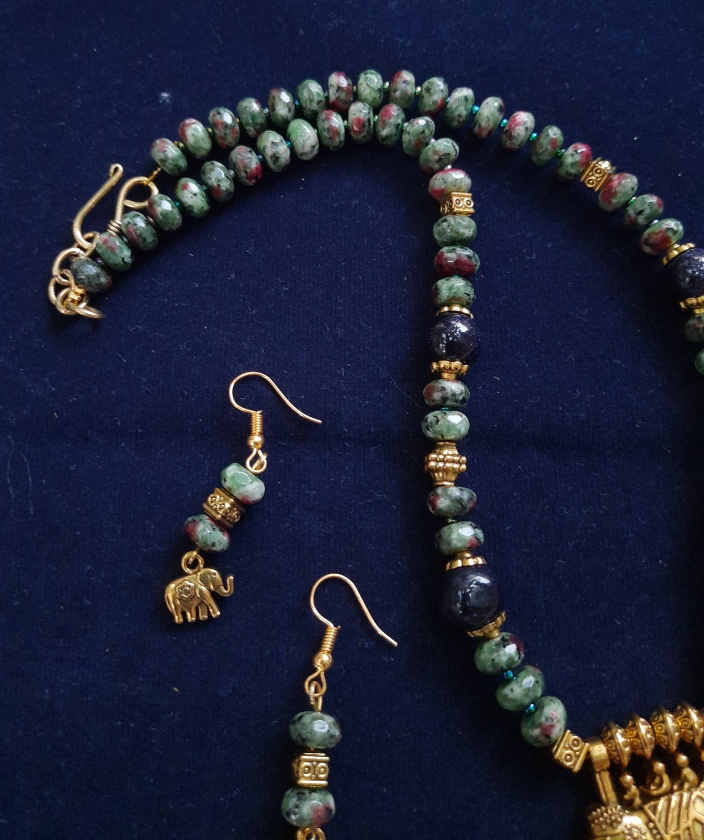 
                  
                    Elegant tyre beads mala with sand beads and elephant pendant.
                  
                