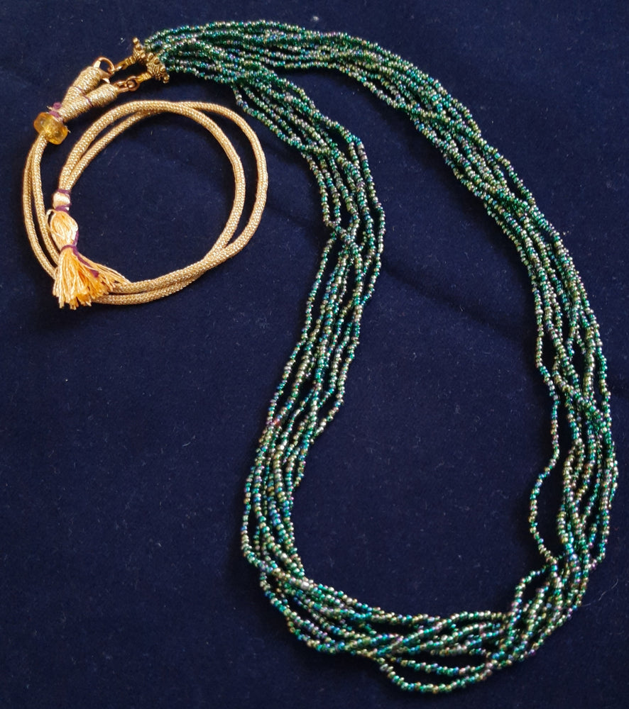 
                  
                    Glimmering green based multicolour multilayered beads mala.
                  
                