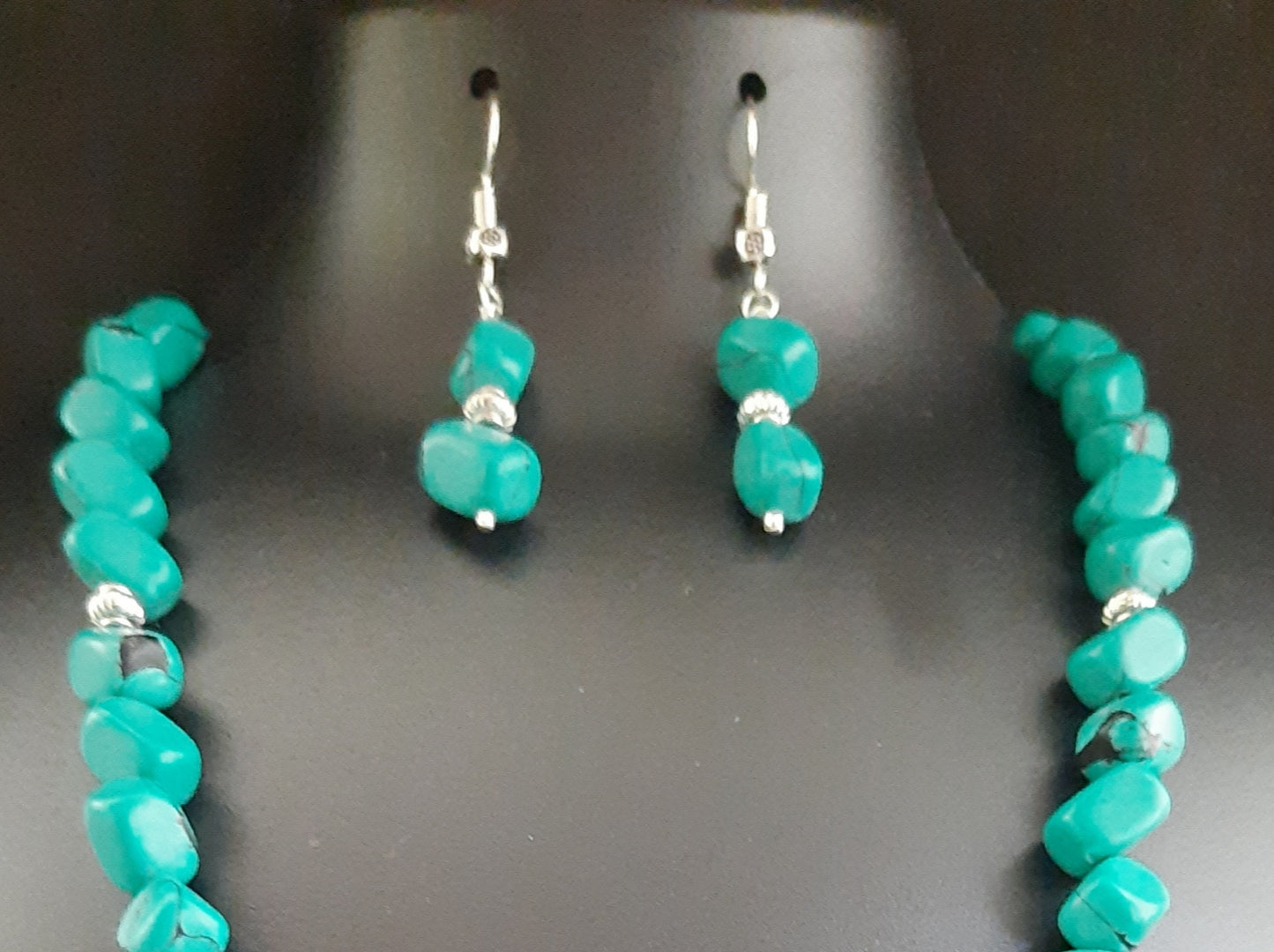 
                  
                    Subtle turquoise blue nuggets beads necklace with pendant and earrings.
                  
                