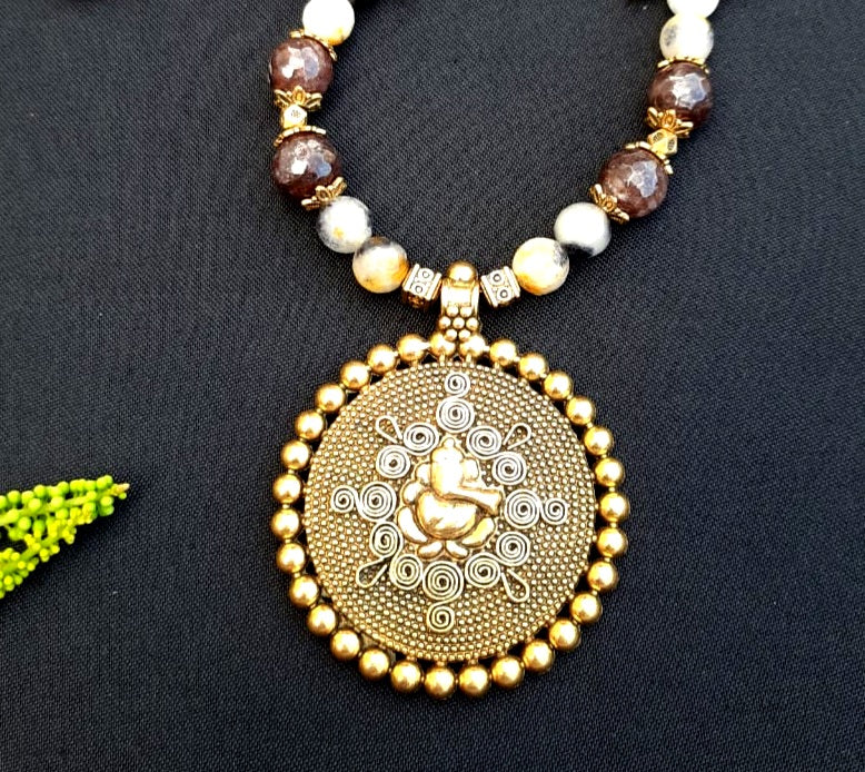
                  
                    Charismatic agate beads necklace with traditional Ganesh pendant.
                  
                