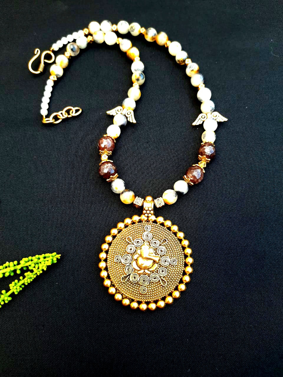 
                  
                    Charismatic agate beads necklace with traditional Ganesh pendant.
                  
                