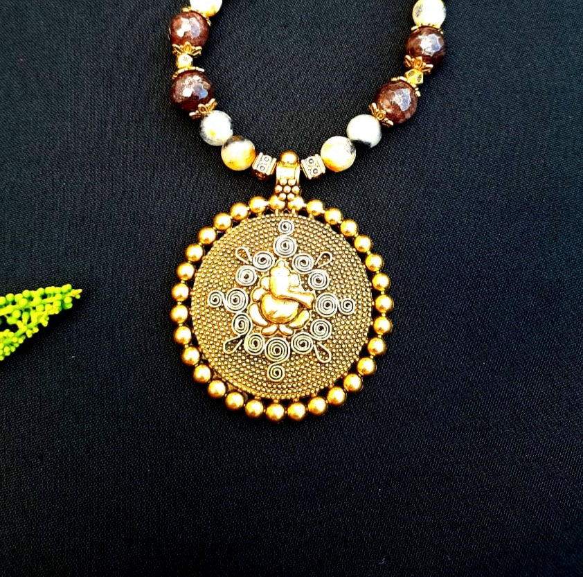 
                  
                    Charismatic agate beads necklace with traditional Ganesh pendant.
                  
                