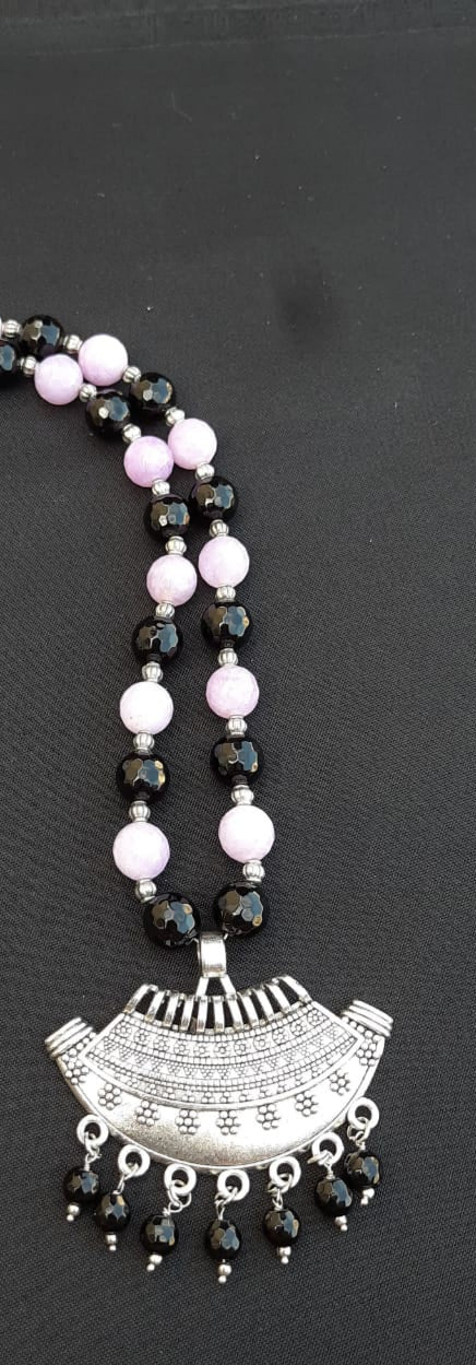 
                  
                    Classic black and purple agate beads necklace with matching pendant.
                  
                
