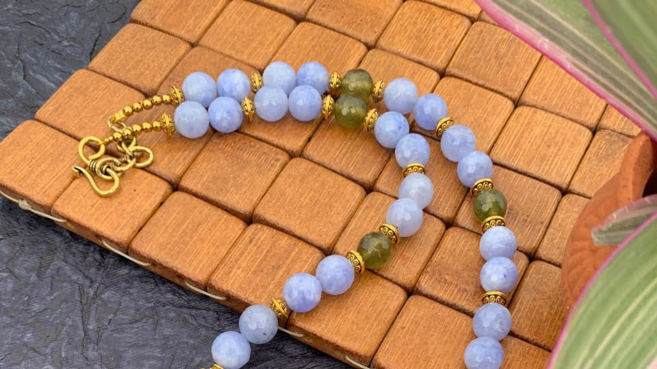 
                  
                    Stylish handcrafted  necklace with baby blue and olive green agate beads
                  
                