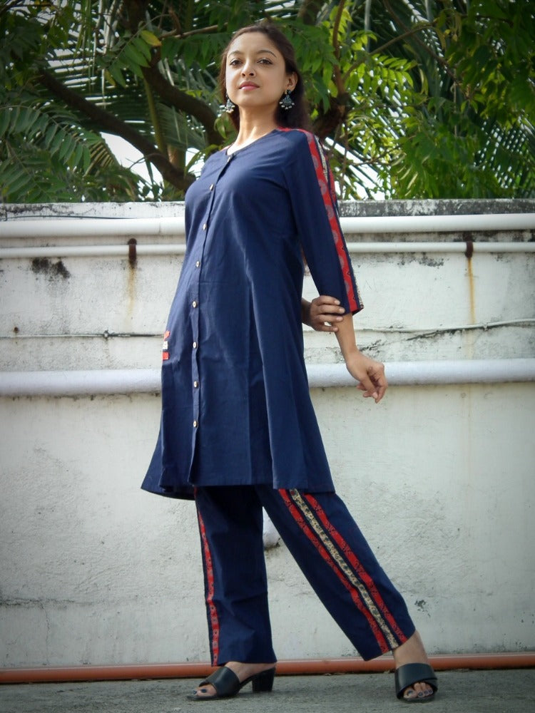 
                  
                    TSAVO - Smart fit, Ajrakh Hand block print highlighted Slim Fit Navy Blue Cotton round neck Kurta Set with palazzo.
                  
                