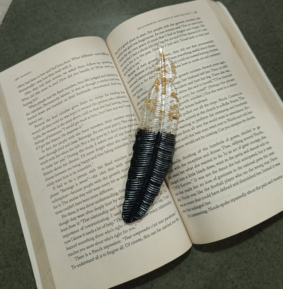 
                  
                    Black and Golden Flakes Feather Bookmark
                  
                