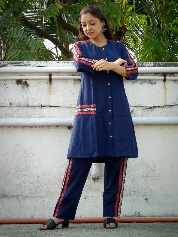 
                  
                    TSAVO - Smart fit, Ajrakh Hand block print highlighted Slim Fit Navy Blue Cotton round neck Kurta Set with palazzo.
                  
                