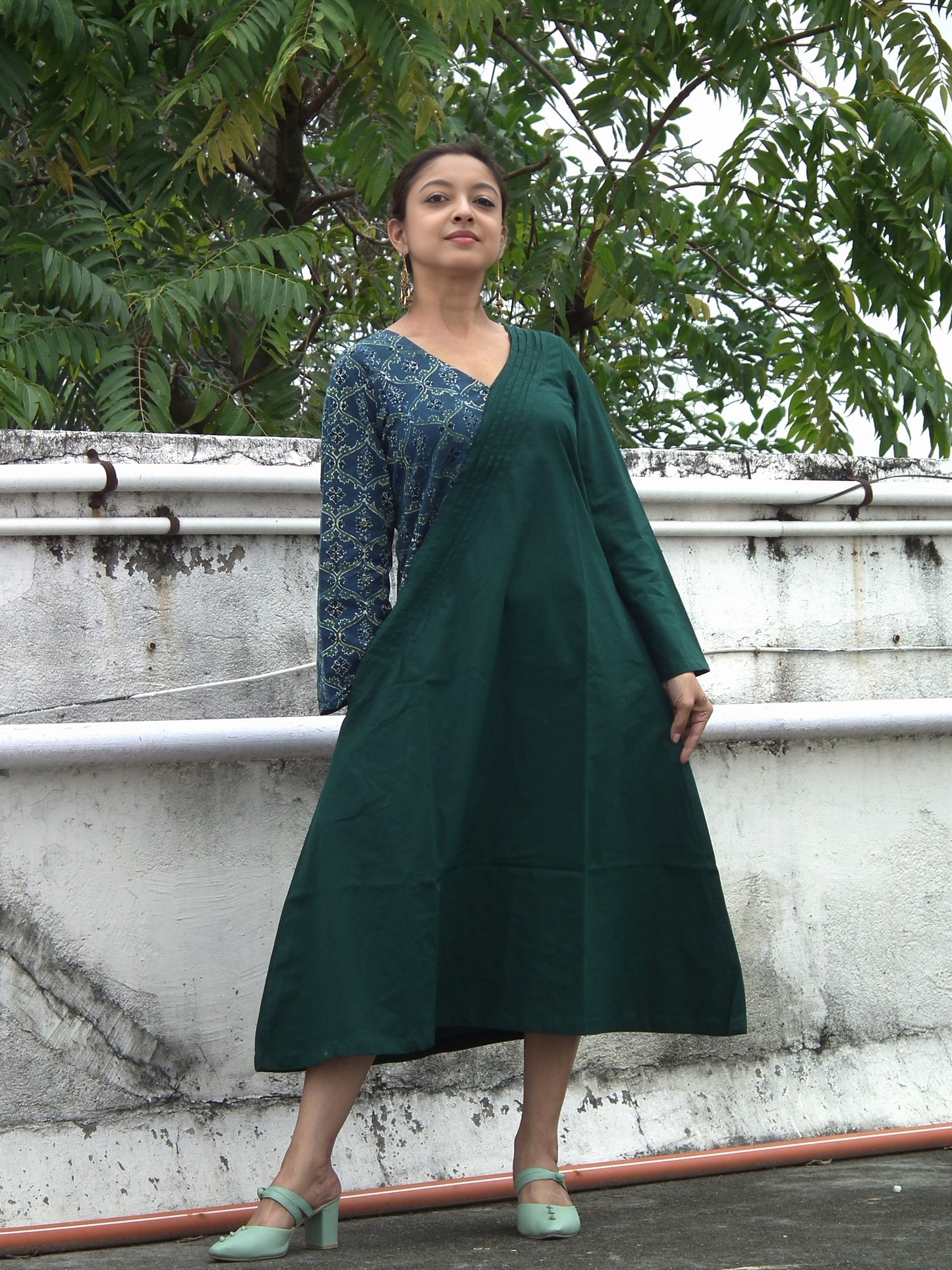 
                  
                    ABASHA - Free Flow Kimono themed Front Up Back Down Flow Dress Ajrakh block Print highlights on right Sleeve and Neck Line .
                  
                
