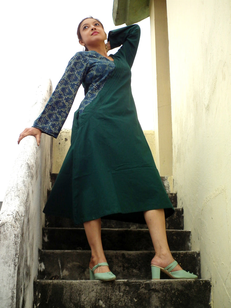
                  
                    ABASHA - Free Flow Kimono themed Front Up Back Down Flow Dress Ajrakh block Print highlights on right Sleeve and Neck Line .
                  
                
