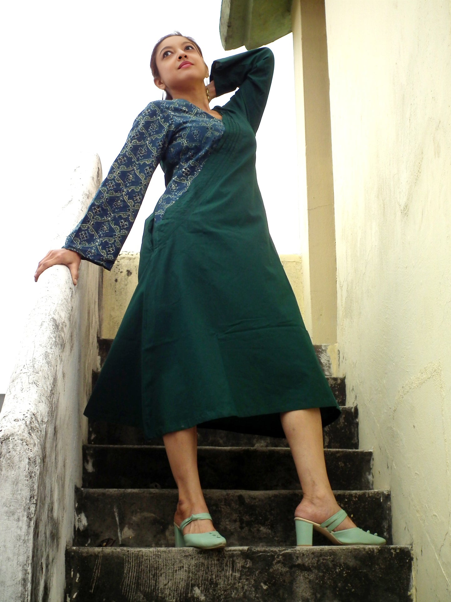 
                  
                    ABASHA - Free Flow Kimono themed Front Up Back Down Flow Dress Ajrakh block Print highlights on right Sleeve and Neck Line .
                  
                