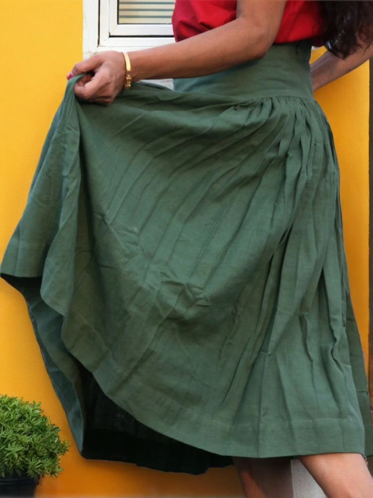 
                  
                    ZEPHYRINE "- Olive  Green Corset-Skirt with sewn-in boning accentuated by a flared pleated Midi A-Line Skirt with Pockets.
                  
                