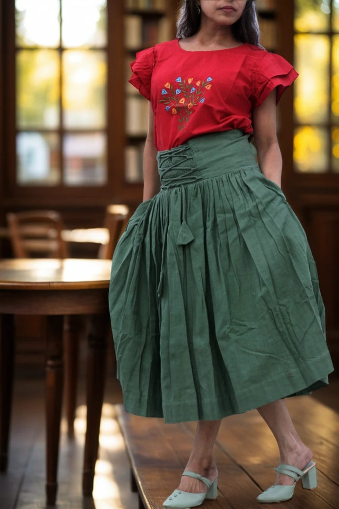 
                  
                    ZEPHYRINE "- Olive  Green Corset-Skirt with sewn-in boning accentuated by a flared pleated Midi A-Line Skirt with Pockets.
                  
                