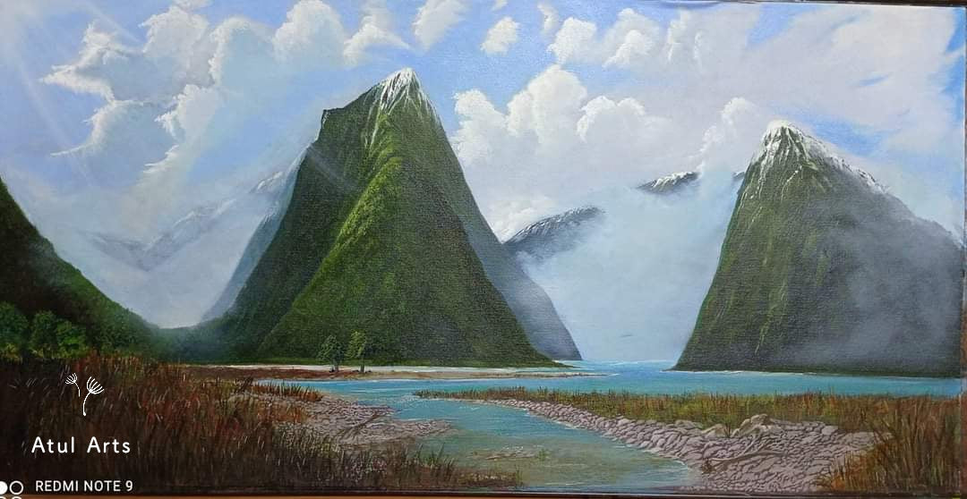 Acrylic painting titled "Nature - Epic Mountains" featuring towering, snow-capped mountains under a cloud-filled blue sky, with a serene, pebble-lined stream in the foreground. Perfect wall decor that evokes grandeur and tranquility by Atul Arts.