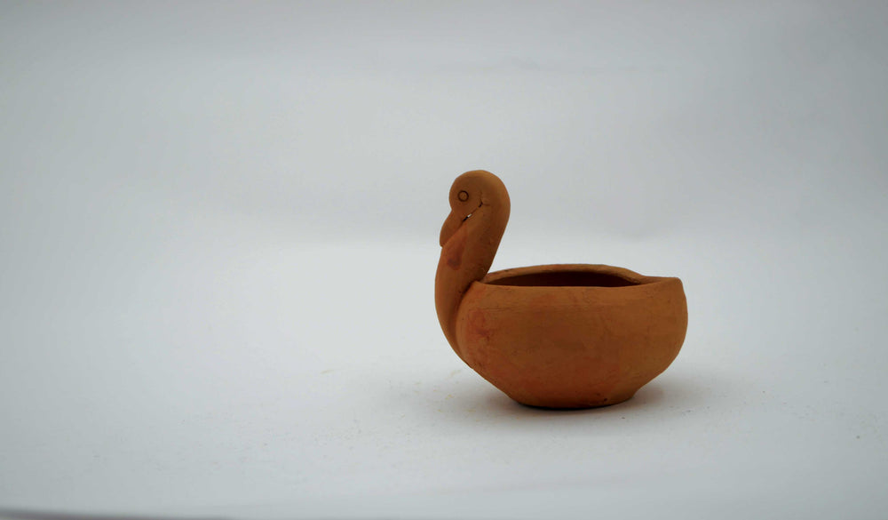 
                  
                    Handmade-Duck-Shaped-Terracotta-Diya-Set-Of-2
                  
                