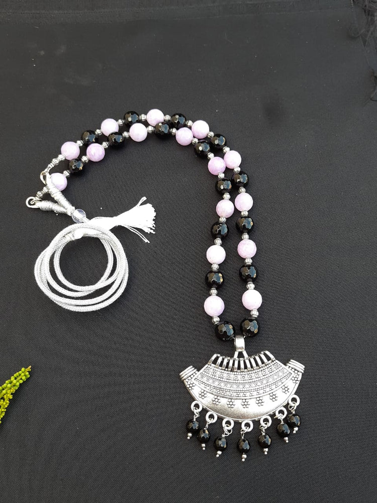 
                  
                    Classic black and purple agate beads necklace with matching pendant.
                  
                