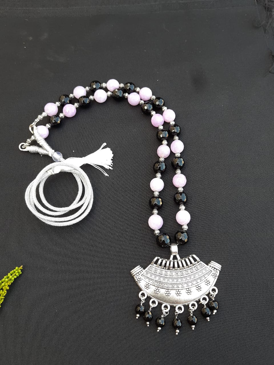 
                  
                    Classic black and purple agate beads necklace with matching pendant.
                  
                