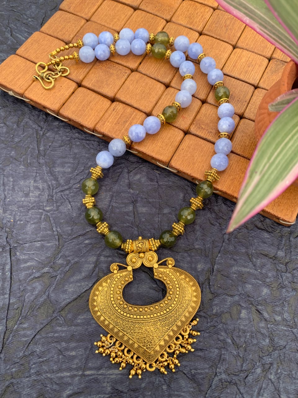 
                  
                    Stylish handcrafted  necklace with baby blue and olive green agate beads
                  
                