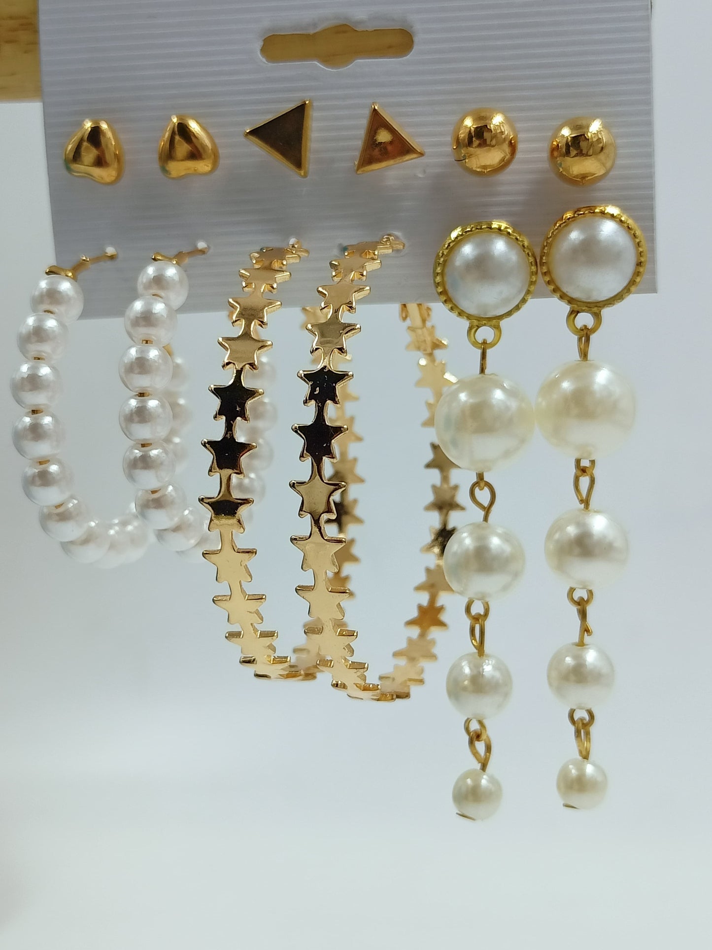 
                  
                    Elegant Pearl Drop Earrings with Oval Gold Frame
                  
                