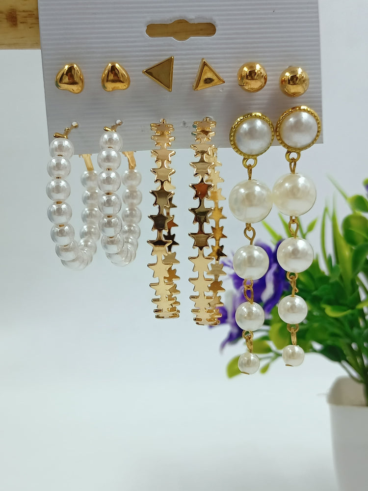 
                  
                    Elegant Pearl Drop Earrings with Oval Gold Frame
                  
                