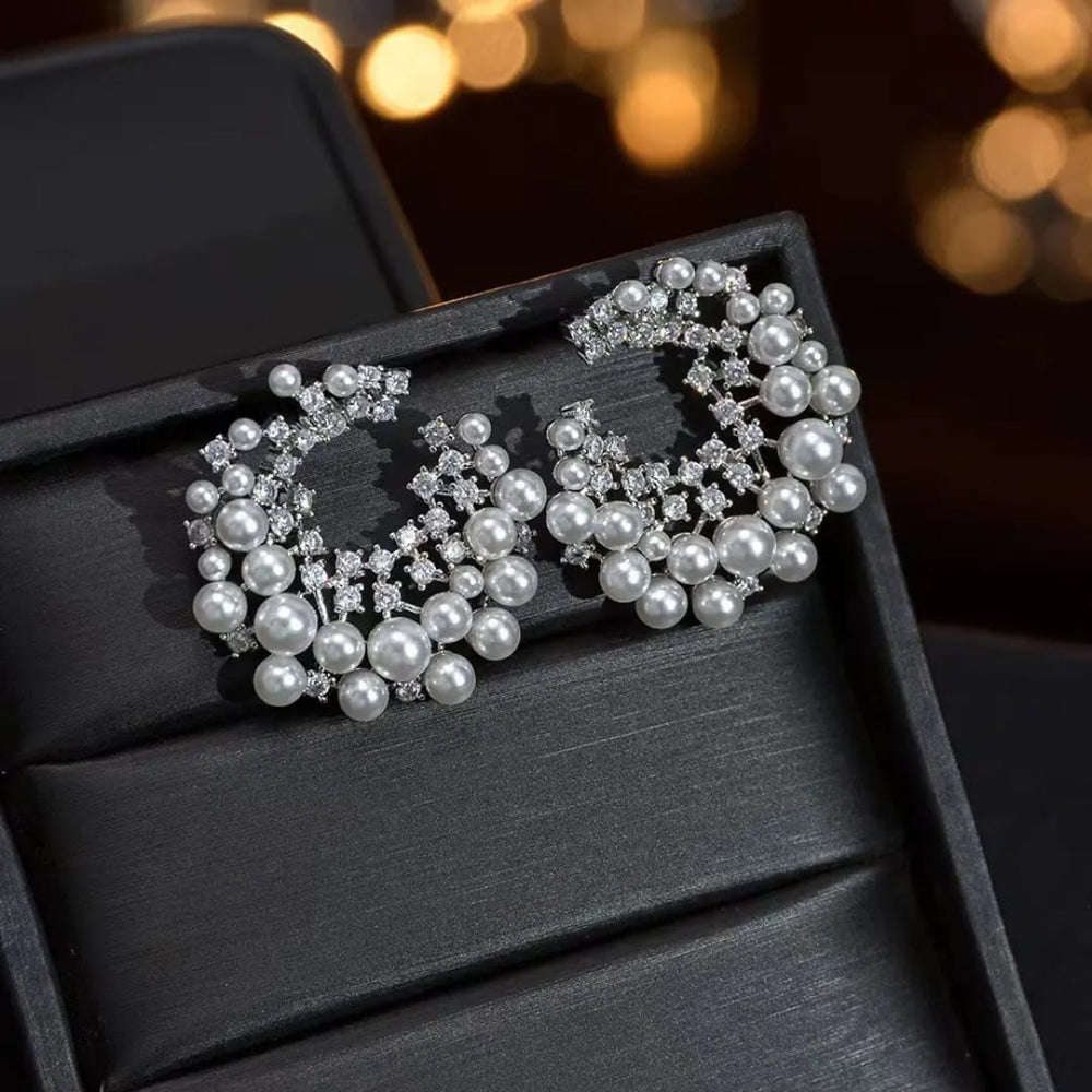 
                  
                    Luxurious Pearl and American Diamond Stud Earrings - Bridal & Occasion Wear
                  
                