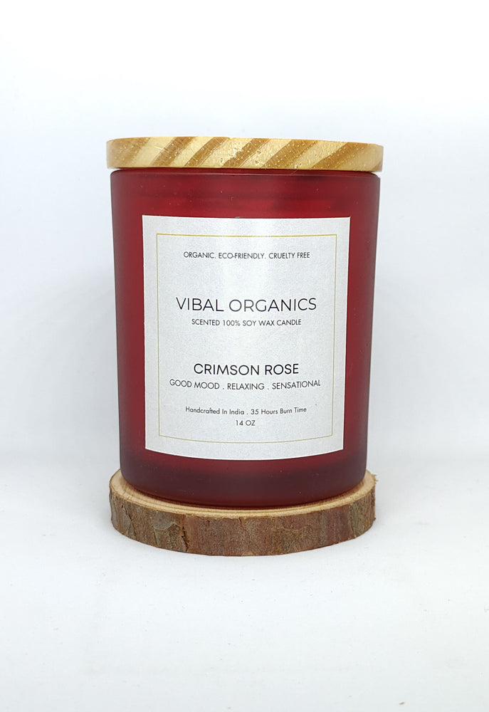 Vibal Organics Crimson Rose Scented Candle in a sleek red glass jar with a wooden lid, perfect for home decor and aromatherapy.