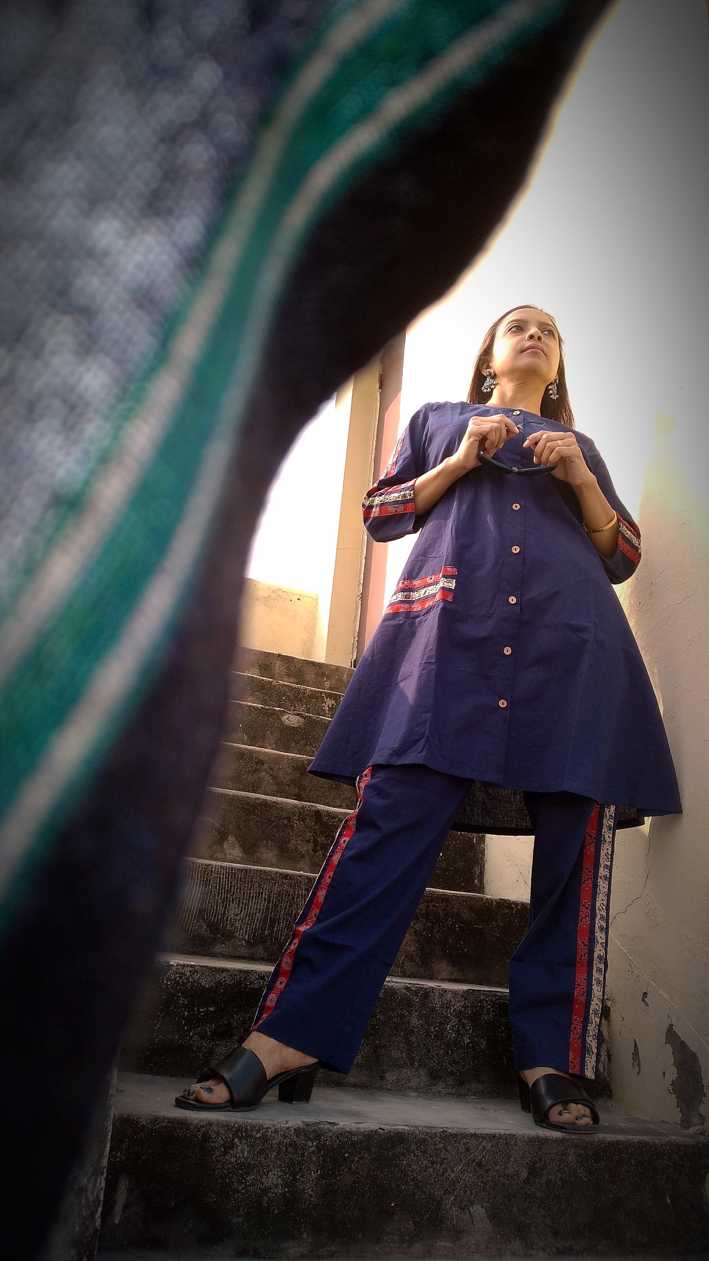 
                  
                    TSAVO - Smart fit, Ajrakh Hand block print highlighted Slim Fit Navy Blue Cotton round neck Kurta Set with palazzo.
                  
                
