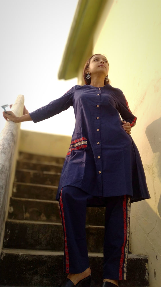 
                  
                    TSAVO - Smart fit, Ajrakh Hand block print highlighted Slim Fit Navy Blue Cotton round neck Kurta Set with palazzo.
                  
                
