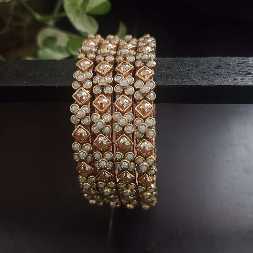 Gold and pearl kundan silk thread bangles