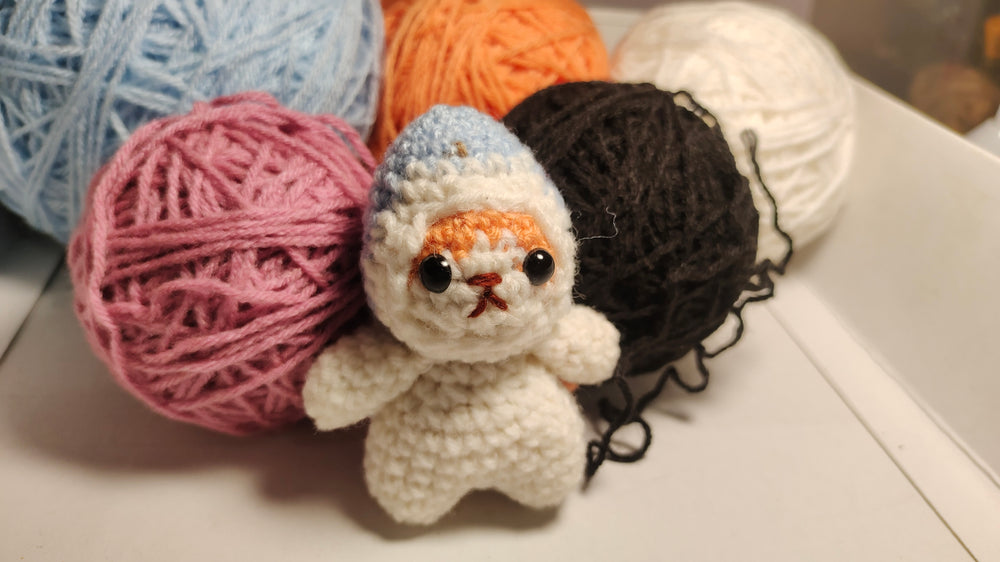 
                  
                    Crochet Cat in Shark Costume Keychain
                  
                