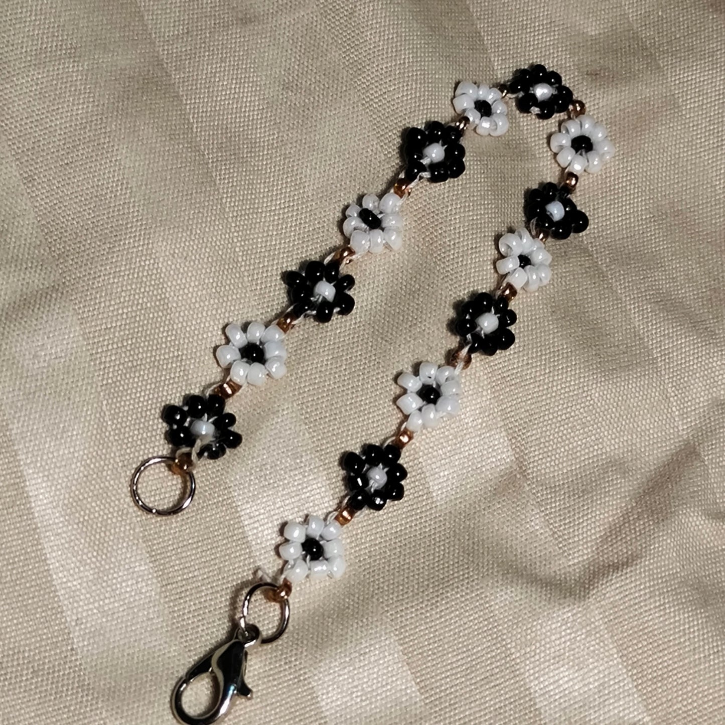 
                  
                    The Enchanted Noir & Ivory Blooms Seed Bead Bracelet
                  
                