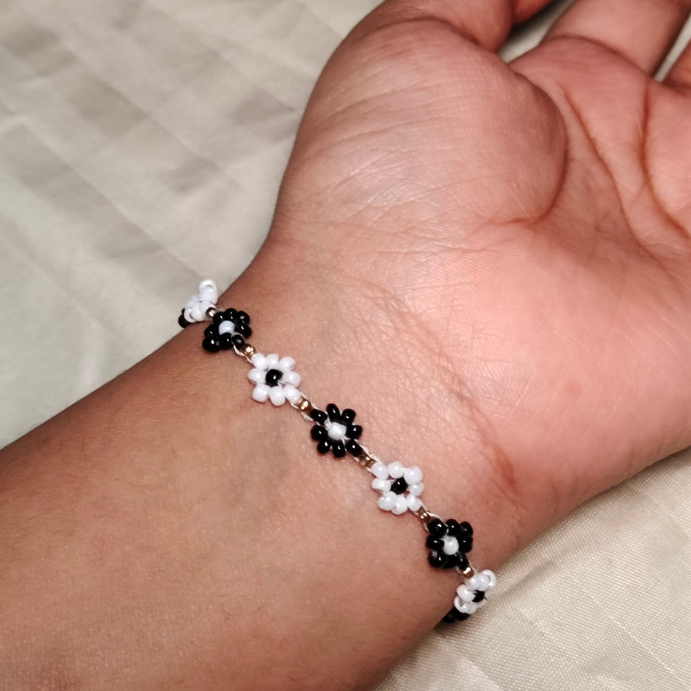 
                  
                    The Enchanted Noir & Ivory Blooms Seed Bead Bracelet
                  
                