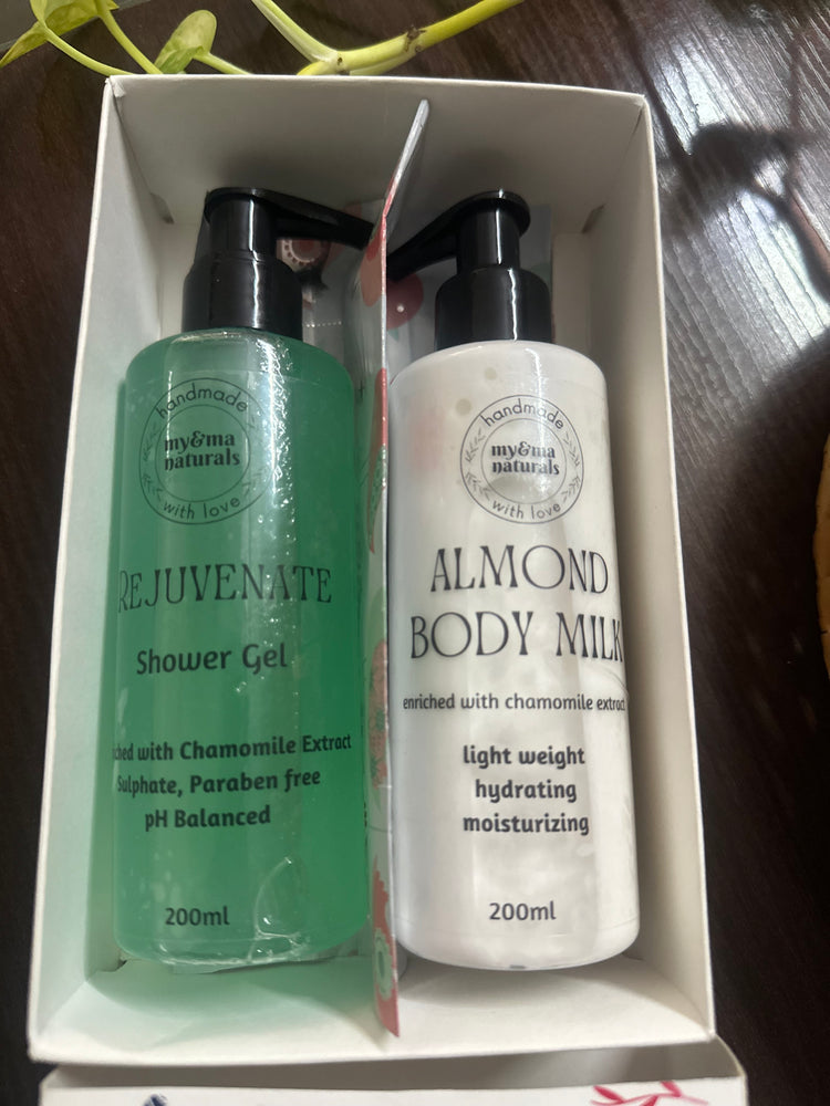 
                  
                    My & Ma Shower Gel+Body Milk Combo (200ml each) - Rejuvenate Shower Gel and Almond Body Milk in elegant packaging with black pumps, enriched with chamomile extract, sulfate-free, paraben-free, and pH balanced for all skin types.
                  
                