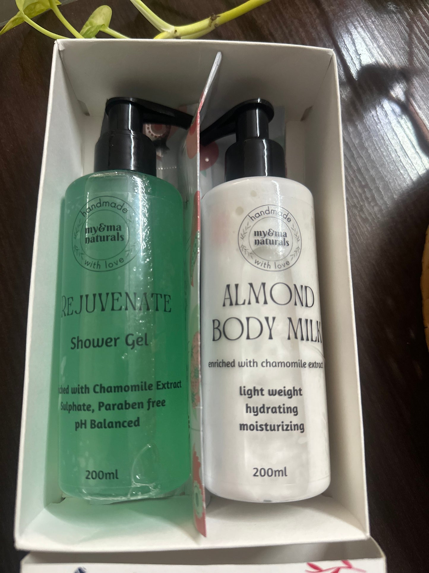 
                  
                    My & Ma Shower Gel+Body Milk Combo (200ml each) - Rejuvenate Shower Gel and Almond Body Milk in elegant packaging with black pumps, enriched with chamomile extract, sulfate-free, paraben-free, and pH balanced for all skin types.
                  
                