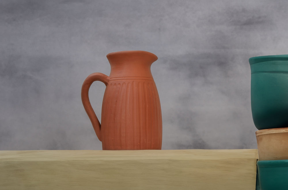 
                  
                    Handmade Terracotta Jug with Carving on All Sides
                  
                