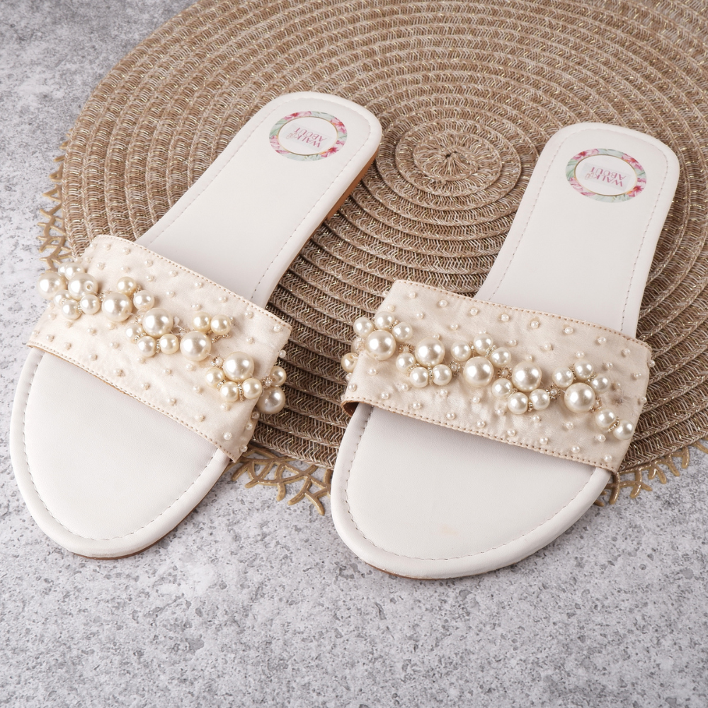 
                  
                    Hand-embroidered Back-open Sliders
                  
                