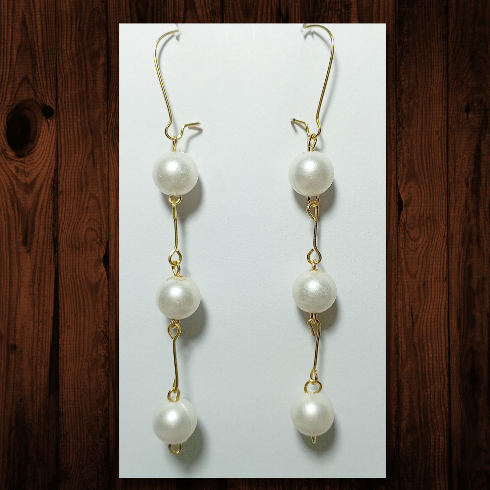 Off-White Alloy EREVER Bow And Pearl Tassel Oversized Earrings at Rs  60/pair in New Delhi