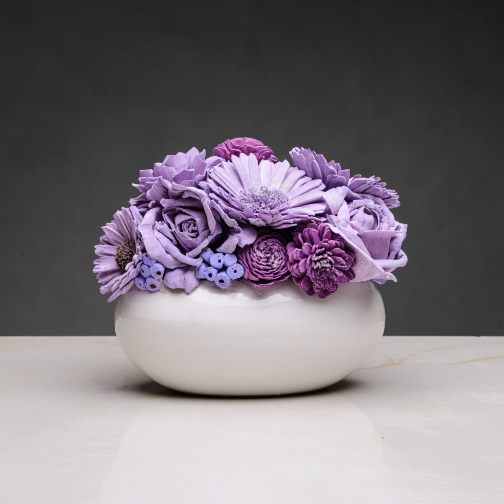 
                  
                    White Ceramic Vase with Lilac and Purple Shade Sola Wood Arrangement
                  
                